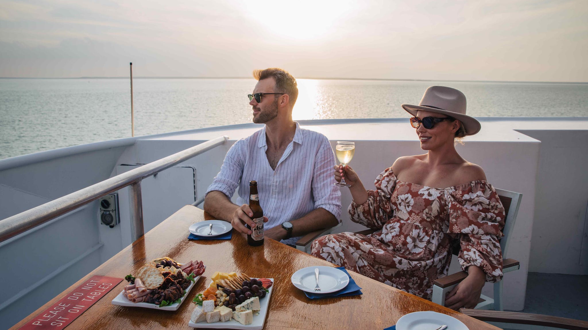 Couple relaxing together on a Darwin Sunset Cruise
